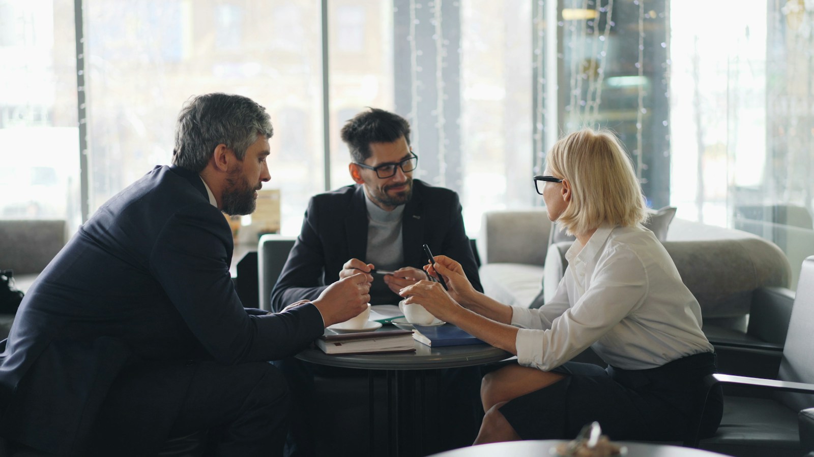 A group of people working together around a table